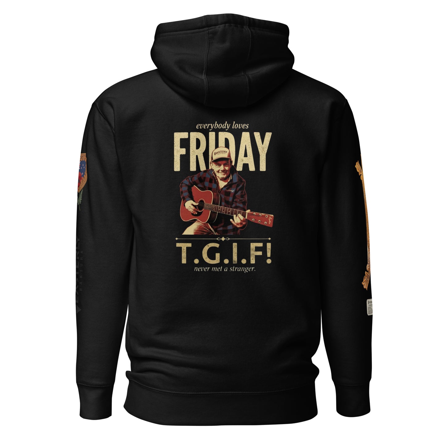 everybody loves FRIDAY — T.G.I.F! hoodie in black, front view. Friday Cavanagh playing guitar, "never met a stranger." Sleeve details visible. EASTERLY.