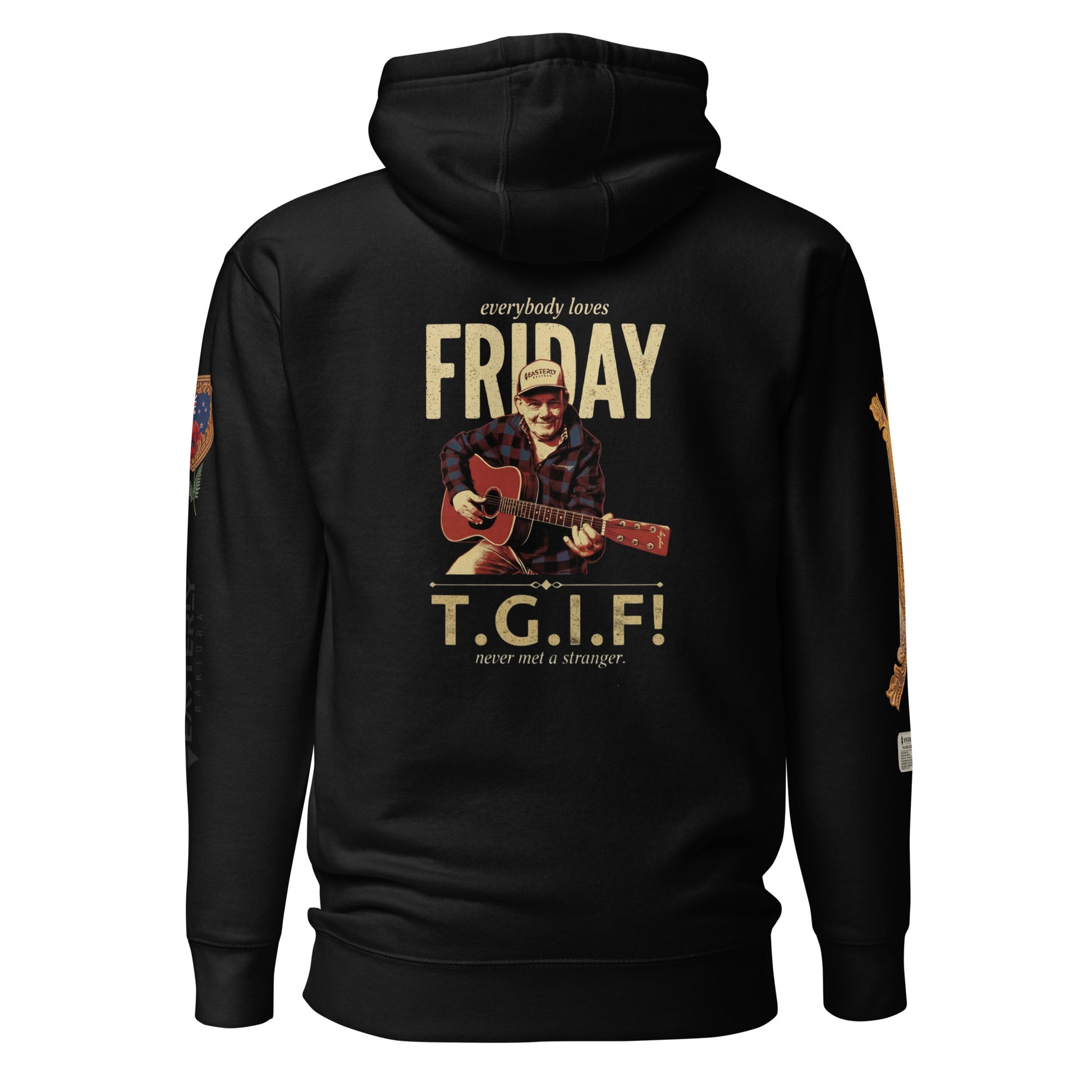 everybody loves FRIDAY — T.G.I.F! hoodie in black, front view. Friday Cavanagh playing guitar, "never met a stranger." Sleeve details visible. EASTERLY.
